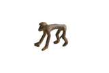 Vintage African dark bronze monkey figurine with a smooth back and rustic, aged patina.