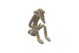 Vintage African bronze sitting monkey giving thumbs up, with an aged greenish-brown patina.