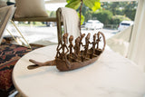 Antique bronze boat with multiple Dogon ancestor figures and aged patina.