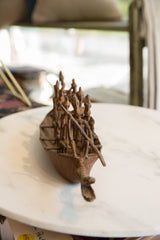 Antique African bronze crocodile boat, detailed figures, and rich historic patina.