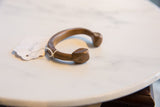 Curved antique African copper and bronze snake cuff with rich patina and faceted ends.