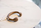 Handmade antique African copper and bronze cuff bracelet, showing its rich patina and attached tag.