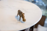 Angled view of the vintage African bronze hippo, highlighting its unique handmade texture.