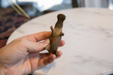 Vintage African bronze hippo, displaying its unique handmade form and aged texture.