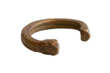 Antique African snake cuff bracelet of bronze and copper with incised geometric markings.