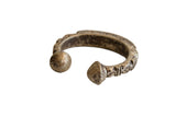 Antique African aluminum snake cuff bracelet with a textured, weathered patina.