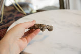 Side view of the antique aluminum snake cuff's substantial profile and textured patina.