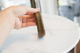 Handcrafted central seam and thick profile of the antique bronze cuff bracelet.