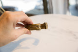 Substantial thickness and grooved texture on the golden patina bronze cuff.
