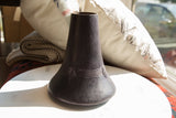 Vintage African wooden vase with etched geometric bands and deep indigo patina.