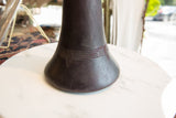 Carved geometric design on the vintage African indigo dyed wooden vase, revealing its purple hue.