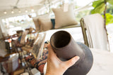 Upper section of vintage African indigo vase, showcasing dark wood, hand-dyed texture, and incised details.