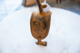 Aged African bronze alloy bird pulley with etched turtle motif and braided edge.