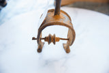 Central wheel and textured base of a vintage African bronze alloy pulley.