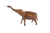 Vintage handmade African copper elephant figurine with raised trunk and aged patina.