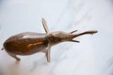 Vintage African copper elephant with an aged patina on its detailed head and extended trunk.