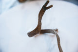 Close-up of the textured, hand-etched patterns on the vintage bronze snake cuff.