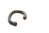 Antique African snake cuff bracelet in dark copper alloy with an aged patina.