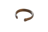Antique African copper alloy snake cuff bracelet with a rustic, handmade finish and aged patina.