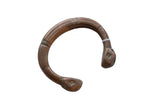 Antique African copper alloy snake cuff with etched details and a rich, aged patina.