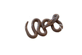 Handmade African mixed metal snake sculpture with a twisting body and dark, rustic patina.