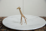 Stylized form of a handmade African copper alloy giraffe with a warm vintage patina.