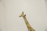 Close-up of the vintage bronze giraffe head in profile, showing its time-softened patina.