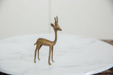 Vintage African bronze fawn sculpture, highlighting its handmade charm and aged patina.
