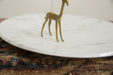 Angled view of the handmade bronze gazelle showing its textured, lightly oxidized patina.