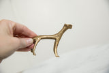 Side profile of a handmade bronze cheetah showing its scale and vintage patina.