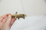 Side view of the handmade bronze elephant, detailing its aged patina and the opening on its back.