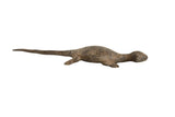 Vintage African bronze lizard collectible with a textured, earthy patina on its long body.