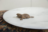 Handmade texture and criss-cross pattern on the back of the vintage bronze frog sculpture.