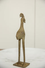 Rear angle of the vintage African bronze long-legged bird, highlighting weathered patina.