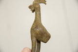 Textured body and rich aged patina of the vintage African bronze bird.