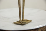 Textured bronze feet and rectangular base of the vintage African bird sculpture.