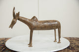Side profile of the vintage African bronze wildebeest highlighting its handmade texture.