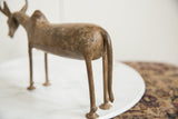 Mottled bronze patina and sculptural form on the rear of a vintage wildebeest figurine.
