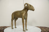 Full profile of the collectible African bronze ram, showing its slender form and aged patina.
