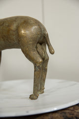Aged bronze texture and handmade form on the hindquarters of the vintage ram figure.