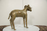 Rear angle of the vintage African bronze ram, detailing its powerful form and aged patina.