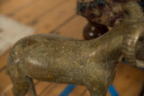 Aged patina and hand-worked surface texture on the vintage bronze ram's torso.
