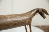 Handmade surface texture and striations along the back of the vintage bronze ram.