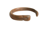Antique African copper snake bracelet with a handcrafted form and a deep, time-worn patina.