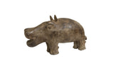 Vintage handmade African bronze hippo sculpture with a rustic, aged patina.