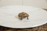 Vintage African bronze turtle, its textured shell displaying unique swirl patterns and rich patina.