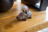 Three-quarter view of the vintage bronze hippo, highlighting its rustic, handmade details.