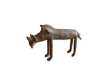 Vintage African bronze warthog sculpture with a rustic, handmade texture and dark patina.