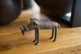 Side profile of the vintage African bronze warthog showcasing its rustic handmade texture.