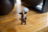 Frontal view highlighting the textured, handmade charm of the bronze warthog figure.